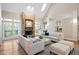 Bright living room with a stone fireplace, skylight, and hardwood floors create an inviting space at 10370 Spaight, Chapel Hill, NC 27517