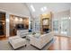 Inviting living room with a rustic stone fireplace, hardwood floors, and ample natural light at 10370 Spaight, Chapel Hill, NC 27517