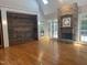 Bright living room features hardwood floors, vaulted ceilings, and a stone fireplace at 10370 Spaight, Chapel Hill, NC 27517