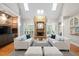 Open-concept living room featuring a striking stone fireplace and bright skylights at 10370 Spaight, Chapel Hill, NC 27517