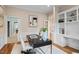 Sophisticated office with built-in shelving and desk area and hardwood floors at 10370 Spaight, Chapel Hill, NC 27517