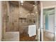 Walk-in shower features a built in niche and tile surround at 10370 Spaight, Chapel Hill, NC 27517