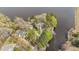 Aerial view of a home on a peninsula showcasing its beautiful waterfront location at 104 Stage Line Cv, Louisburg, NC 27549