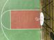 Aerial view of a basketball hoop and colorful sport court surface at 104 Stage Line Cv, Louisburg, NC 27549