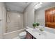 Neutral bathroom with vanity, tub and shower featuring tile surround at 104 Stage Line Cv, Louisburg, NC 27549