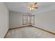 Bedroom with soft carpet, a ceiling fan, and natural light from windows at 104 Stage Line Cv, Louisburg, NC 27549