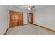 Bedroom featuring closet, neutral carpet and wooden trim at 104 Stage Line Cv, Louisburg, NC 27549