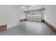 Spacious two car garage with white walls and brick trim at 104 Stage Line Cv, Louisburg, NC 27549