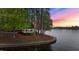 Waterfront gazebo nestled among trees, offering serene views and scenic sunset background at 104 Stage Line Cv, Louisburg, NC 27549