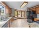 Bright kitchen features wood cabinets, granite counters, a bay window, and stainless-steel appliances at 104 Stage Line Cv, Louisburg, NC 27549