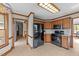 Kitchen boasts wood cabinets, granite counters, and stainless-steel appliances, offering both style and functionality at 104 Stage Line Cv, Louisburg, NC 27549