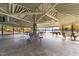 Interior view of large pavilion with many picnic tables and lake views through the open walls at 104 Stage Line Cv, Louisburg, NC 27549