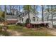 A home exterior with a large deck and well-maintained landscaping at 104 Stage Line Cv, Louisburg, NC 27549