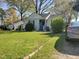 Charming one-story home featuring a spacious lawn, mature trees, and an inviting front porch at 109 Plainview Ave, Raleigh, NC 27604