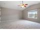 Bright bedroom featuring vaulted ceilings, a ceiling fan, and a window with neighborhood views at 109 Wyeth Meadows Ln, Holly Springs, NC 27540