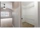 Walk-in closet with carpet and shelving in a home's bedroom at 109 Wyeth Meadows Ln, Holly Springs, NC 27540