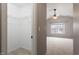View from the interior of a closet looking out at a spacious bedroom at 109 Wyeth Meadows Ln, Holly Springs, NC 27540