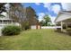Expansive backyard with a detached garage and plenty of green space for outdoor activities at 1104 W Cole St, Dunn, NC 28334