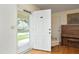 Bright entryway with hardwood floors, open door, and vintage charm at 1104 W Cole St, Dunn, NC 28334