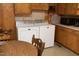 Laundry area with a modern washer and dryer near the cabinets at 1104 W Cole St, Dunn, NC 28334