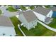 Aerial view of the home and backyard, with a fenced in lawn in a planned community at 111 Flying Point Ln, Clayton, NC 27520