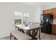 Cozy dining area features a wooden table, bench seating, and natural light at 111 Flying Point Ln, Clayton, NC 27520