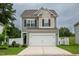 Charming two-story home features a two-car garage and well-maintained lawn at 111 Flying Point Ln, Clayton, NC 27520