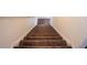 Staircase with neutral carpeting, leading upwards with natural light at 111 Flying Point Ln, Clayton, NC 27520