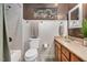 Bathroom featuring a shower/tub combo, a toilet and a wooden vanity with sink at 1117 Country Brooke Dr, Raleigh, NC 27603