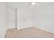 Bedroom featuring neutral carpet, a ceiling fan, and two white closets at 1117 Country Brooke Dr, Raleigh, NC 27603