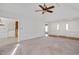 Bright and airy living area with vaulted ceiling, ceiling fan, and doorways leading to other rooms at 1117 Country Brooke Dr, Raleigh, NC 27603
