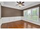 Charming office with hardwood floors, classic wainscoting, and abundant natural light from large windows at 1117 Country Brooke Dr, Raleigh, NC 27603