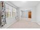 This bedroom features neutral carpet, walls, and trim, and a large sliding-door closet with mirrors at 116 Marlowe Court Ct, Carrboro, NC 27510