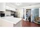 Bright kitchen featuring wood floors with access to laundry room and patio at 116 Marlowe Court Ct, Carrboro, NC 27510