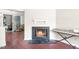 Cozy living room showcases a black fireplace, hardwood floors, and easy access to the outdoor space at 116 Marlowe Court Ct, Carrboro, NC 27510