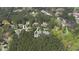 A scenic aerial view of luxurious homes nestled among lush trees and greenery at 125 Dartmoor Ln, Raleigh, NC 27614