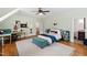 Large bedroom with hardwood floors, ceiling fan, and a comfortable decor at 125 Dartmoor Ln, Raleigh, NC 27614