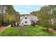 Beautiful home featuring a well-manicured lawn, mature trees, and a serene setting, offering an inviting curb appeal at 125 Dartmoor Ln, Raleigh, NC 27614