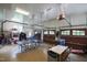 Spacious three-car garage equipped with a ping pong table, a sitting area, and garage door openers at 125 Dartmoor Ln, Raleigh, NC 27614