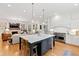 Beautiful kitchen with an open concept, large island, and modern appliances at 125 Dartmoor Ln, Raleigh, NC 27614