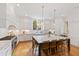 Open kitchen featuring a large island with seating, ample cabinet space, and a view of the backyard at 125 Dartmoor Ln, Raleigh, NC 27614