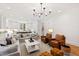 Bright living room with an open concept leading to a modern kitchen at 125 Dartmoor Ln, Raleigh, NC 27614