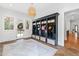 Well-organized mudroom with built-in cubbies, storage baskets, and a large window for natural light at 125 Dartmoor Ln, Raleigh, NC 27614