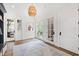 Bright mudroom with tile floors, French doors, and ample natural light illuminating the space at 125 Dartmoor Ln, Raleigh, NC 27614