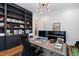 Well-appointed office features built-in shelving and a sleek modern desk at 125 Dartmoor Ln, Raleigh, NC 27614
