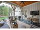 Relaxing outdoor porch with seating, a ceiling fan, and TV, perfect for entertaining or enjoying quiet moments at 125 Dartmoor Ln, Raleigh, NC 27614