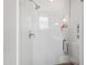 Contemporary glass shower features white subway tile and chrome fixtures at 125 Dartmoor Ln, Raleigh, NC 27614