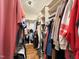 Organized walk-in closet with ample shelving and hanging space for clothes and accessories at 125 Dartmoor Ln, Raleigh, NC 27614