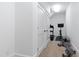 Hallway area with gym equipment and storage closets, perfect for a home workout area at 125 Dartmoor Ln, Raleigh, NC 27614