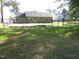 Fenced-in backyard with a view of the house, providing a safe and private outdoor space at 126 Creedmoor Rd, Stem, NC 27581